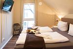 Schlafzimmer - Ferienwohnung FÖRDEBEACH Solitüde - Top-Hundeurlaub