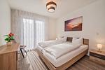 Schlafzimmer - Ferienwohnung Klippenblick mit Sauna, Kinderspielbereich und Fitnessraum - Top-Hundeurlaub