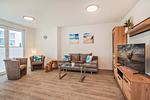 Wohnzimmer - Ferienwohnung Klippenblick mit Sauna, Kinderspielbereich und Fitnessraum - Top-Hundeurlaub