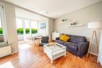 Wohnzimmer mit Zugang zur Terrasse - Wohnung 035EG - Top-Hundeurlaub