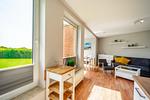 Wohnzimmer mit Sessel - Wohnung 035EG - Top-Hundeurlaub