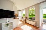 TV im Wohnbereich - Wohnung 035EG - Top-Hundeurlaub