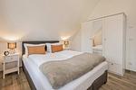 Schlafzimmer - Ferienhaus JoHann mit Sauna, großer Terrasse und moderner Einrichtung - Top-Hundeurlaub