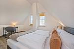 Schlafzimmer - Ferienhaus JoHann mit Sauna, großer Terrasse und moderner Einrichtung - Top-Hundeurlaub