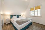 Schlafzimmer - Ferienhaus JoHann mit Sauna, großer Terrasse und moderner Einrichtung - Top-Hundeurlaub