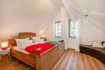 Schlafzimmer - Ferienhaus Auszeitfischer mit Sauna, Kamin und Terrasse - Top-Hundeurlaub