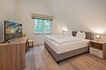 Schlafzimmer - Ferienhaus Im Kiefernwäldchen mit Sauna, Kamin und Terrasse - Top-Hundeurlaub