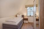 Schlafzimmer - Ferienhaus Im Kiefernwäldchen mit Sauna, Kamin und Terrasse - Top-Hundeurlaub