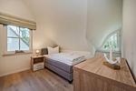 Schlafzimmer - Ferienhaus Im Kiefernwäldchen mit Sauna, Kamin und Terrasse - Top-Hundeurlaub