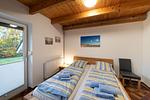 Schlafzimmer mit Doppelbett - Ferienhaus Austernfischer - Top-Hundeurlaub