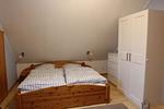 Schlafzimmer mit Doppelbett - Ferienhaus Hus am Diek - Top-Hundeurlaub