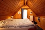 Schlafzimmer mit Doppelbett - Ferienhaus Seepferdchen - Top-Hundeurlaub