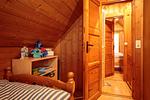 Schlafzimmer mit zwei Einzelbetten - Ferienhaus Seepferdchen - Top-Hundeurlaub