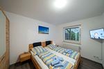 Schlafzimmer mit Doppelbett - Ferienhaus Seestern I - Top-Hundeurlaub