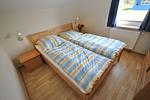 Schlafzimmer mit Doppelbett - Ferienhaus Strandmuschel - Top-Hundeurlaub