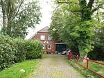 Fassade / Eingang - Ferienwohnung Berdumer Mühlenblick - Top-Hundeurlaub