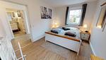Schlafzimmer - Haus Friedrichstr. 16a Typ O - Top-Hundeurlaub