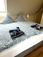 Schlafzimmer - Maisonette Ferienwohnung "Barke App. 26" mit seitlichem Meerblick in Scharbeutz - Top-Hundeurlaub