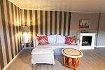 Wohnzimmer - Ferienhaus Captains Lodge Steinbergkirche - Top-Hundeurlaub