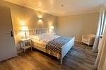 Schlafzimmer - Ferienhaus Captains Lodge Steinbergkirche - Top-Hundeurlaub