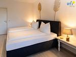 Schlafzimmer - Ferienwohnung Sonnenaufgang - Top-Hundeurlaub