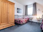 Schlafzimmer mit Einzelbetten in der 1. Etage - Ferienwohnung Ohana - Top-Hundeurlaub