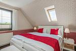 Schlafzimmer - Ferienhaus Sonnendeck mit Sauna, Kamin & Terrasse für 12 Personen - Top-Hundeurlaub