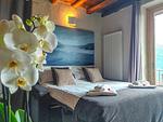 toll dekoriertes Schlafzimmer mit großem Bett - Sunrise Lodge - Top-Hundeurlaub