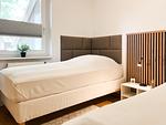 erstes Schlafzimmer mit Einzelbetten - Haus 20a - Top-Hundeurlaub