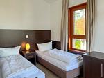 Schlafzimmer - Apartment 433 mit Seeblick und Kamin - Top-Hundeurlaub