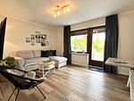Wohnzimmer - FeWo - Coastal Residence 1, mit Garten, umzäunt - Top-Hundeurlaub