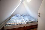 Schlafzimmer unter dem Dach in der Ferienwohnung Skagen - Reetdachhaus Skagen - Top-Hundeurlaub