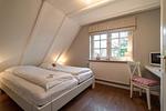 Schlafzimmer - Haus am Leuchtturm Hausteil 1 - Top-Hundeurlaub