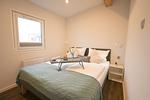 Schlafzimmer - Ferienhaus Ostseechalet Kompass Gelting - Top-Hundeurlaub