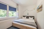 Schlafzimmer - Ferienwohnung Emily mit Garten, Sauna und Terrasse mit Grill - Top-Hundeurlaub
