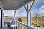 Überdachter Balkon mit Sitzgelegenheit - Resort Deichgraf 27-14 - Top-Hundeurlaub