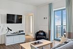Wohn-Essbereich mit Couch und Flatscreen-TV - Ohlerich Speicher 4-26 - Top-Hundeurlaub
