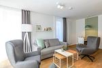 Wohnbereich mit Couch und Sessel - Apartmentvilla Anna See 1-10 - Top-Hundeurlaub