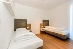 Schlafzimmer mit zwei Einzelbetten - Apartmentvilla Anna See 1-15 - Top-Hundeurlaub