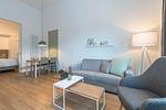 Wohnbereich mit Schlafsofa und Esstisch - Apartmentvilla Anna See 3-08 - Top-Hundeurlaub