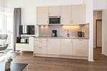 Küchenzeile und Tv - Apartmentvilla Anna See 3-16 - Top-Hundeurlaub