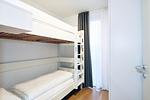 Schlafzimmer mit Etagenbett - Deichhäuser Anna Küste 3-30 - Top-Hundeurlaub