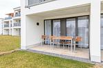 Überdachte Loggia mit Sitzgelegenheit - Deichhäuser Anna Küste 4-10 - Top-Hundeurlaub