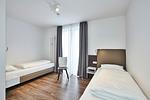 Schlafzimmer mit zwei Einzelbetten - Deichhäuser Anna Küste 4-34 - Top-Hundeurlaub