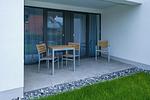 Überdachte Terrasse mit Sitzgelegenheit - Deichhäuser Anna Küste 6-12 - Top-Hundeurlaub