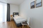 Schlafzimmer mit zwei Einzelbetten - Deichhäuser Anna Küste 7-34 - Top-Hundeurlaub