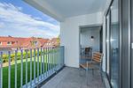 Überdachter Balkon mit Sitzgelegenheit - Deichhäuser Anna Küste 8-23 - Top-Hundeurlaub
