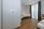 Schlafzimmer mit zwei Einzelbetten - Deichhäuser Anna Küste 8-24 - Top-Hundeurlaub