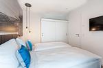 Schlafzimmer mit Kleiderschrank - Apartmentanlage Meerblickvilla 1-12 - Top-Hundeurlaub