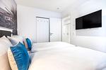 Schlafzimmer mit Flatscreen-TV - Apartmentanlage Meerblickvilla 1-14 - Top-Hundeurlaub